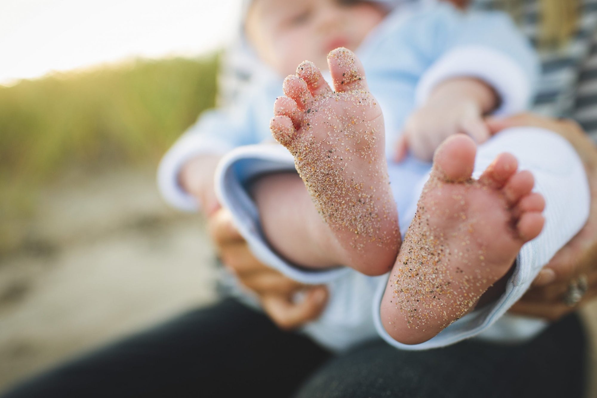 sun protection for baby during the summer baby with sandy feet