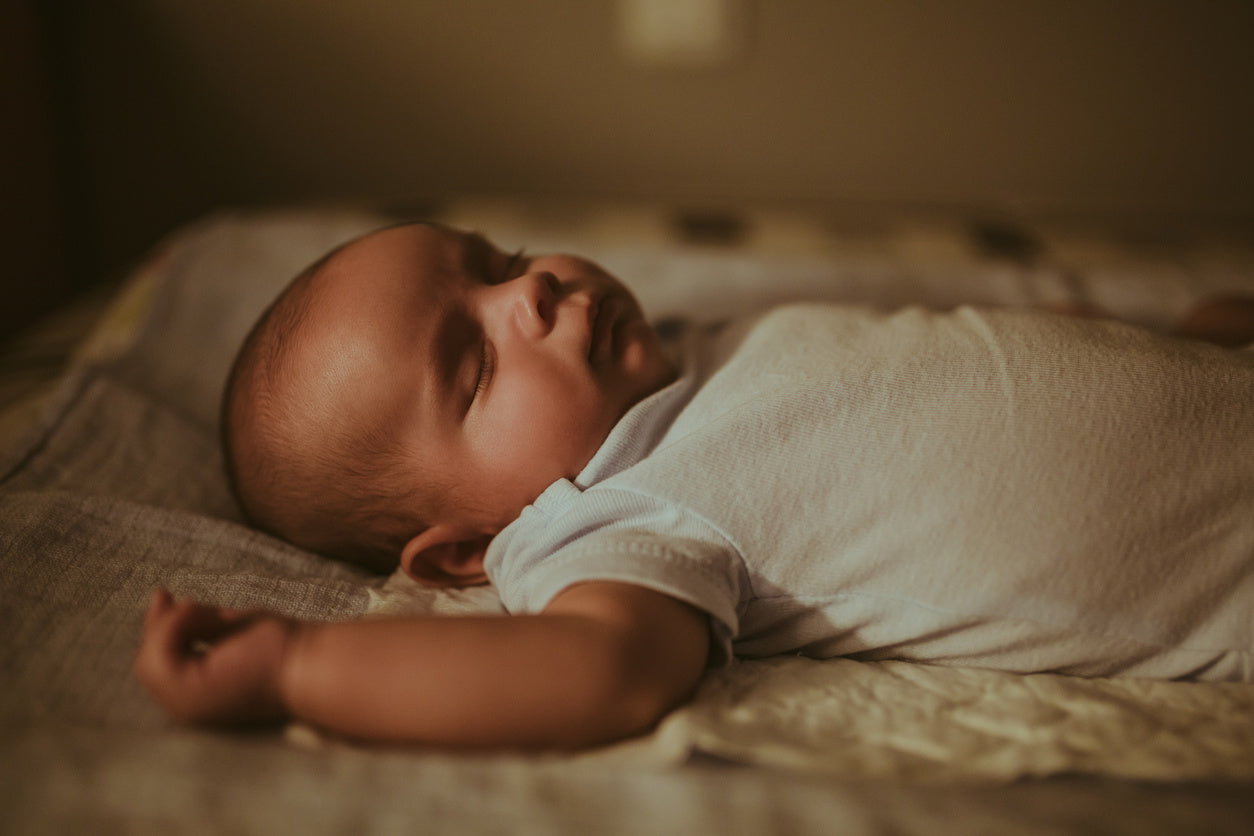 baby sleeping on its back in crib when can babies sleep on their stomachs